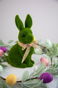 green Easter bunny against a white wall
