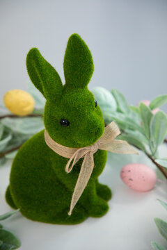 green Easter bunny against a white wall
