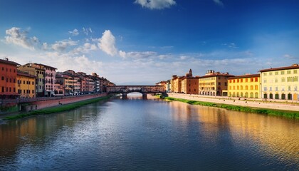 Obraz premium view looking along the arno river towards the middle bridge pisa