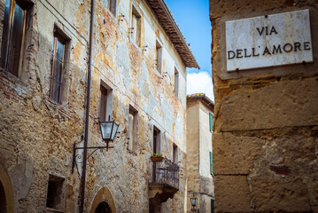 Pienza, Toscana, Italy: Via Dell'Amore street sign on old building wall