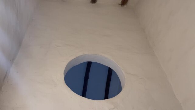 window with a view of the ceiling in a colonial house. Beautiful Spanish colonial Art Deco architecture style building of train station interior exterior facade detail view