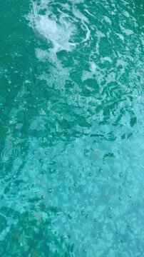 blue water texture swimming pool water. Swimming pool bottom caustics ripple and flow with waves background. Summer background. Texture of water surface. Overhead view. 