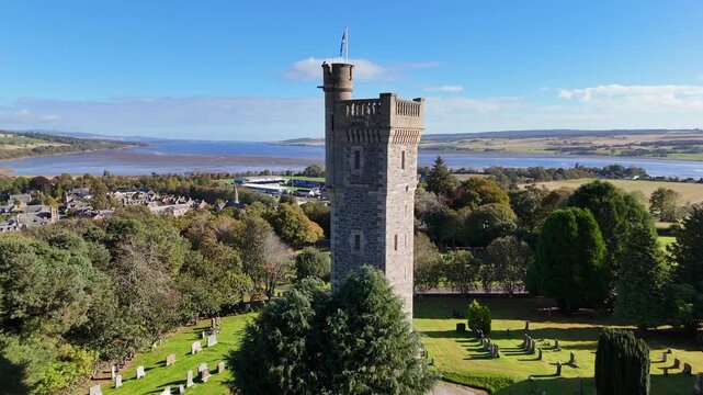 Stunning 4K Aerial Drone Perspective of Macdonald Memorial Tower Dominating Dingwall in the Scottish Highlands &ndash; Iconic Historic Monument Surrounded by Dramatic Highland Scenery
