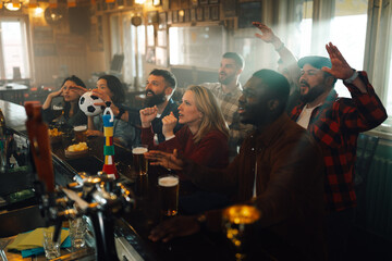 People watching soccer match in pub cheering goal © Zamrznuti tonovi