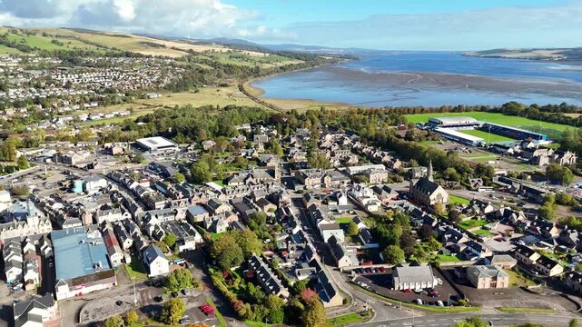 Cinematic Aerial Drone View of Dingwall Town in the Scottish Highlands from Above Featuring and Scenic Highland Landscape

