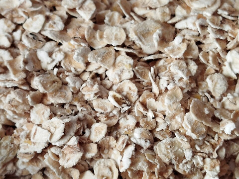Primer plano de una gran cantidad de copos de avena integrales naturales