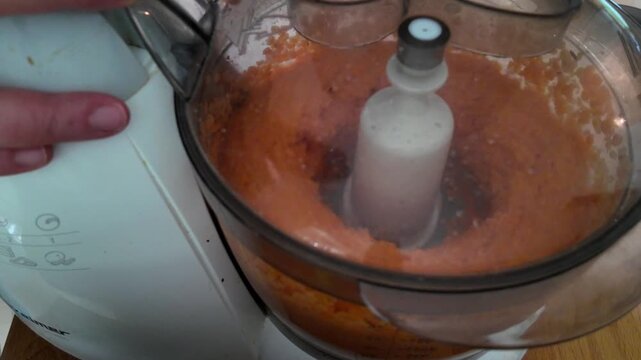 making red lentil patties with green peas in a food processor