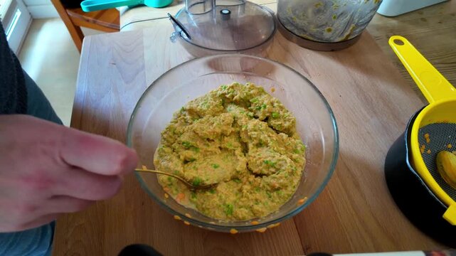 making red lentil patties with green peas in a food processor