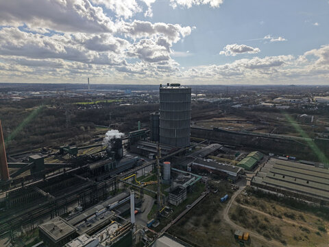 Aerial View of a Massive Industrial Gasometer and Heavy Industry Steelworks in Germany, Ruhr area 