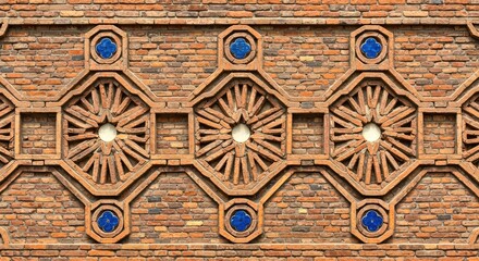 Obraz premium Ornate brick wall featuring a repeating pattern of decorative geometric shapes with central windows and blue tiled accents, showcasing intricate architectural design