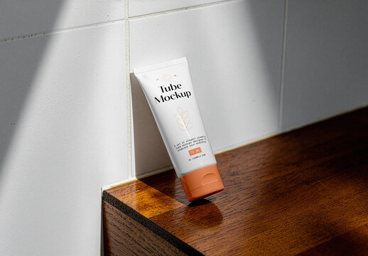 Cosmetic Tube Leans Against The Wall Mockup