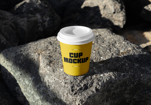 Coffee Cup Standing on Rock Mockup
