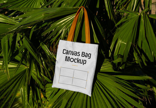 Canvas Bag Lying Between Leaves Mockup
