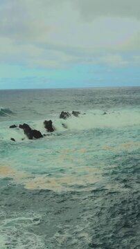 Atlantic Ocean surf hitting rocky shore in Funchal, Madeira, Apple Log 2