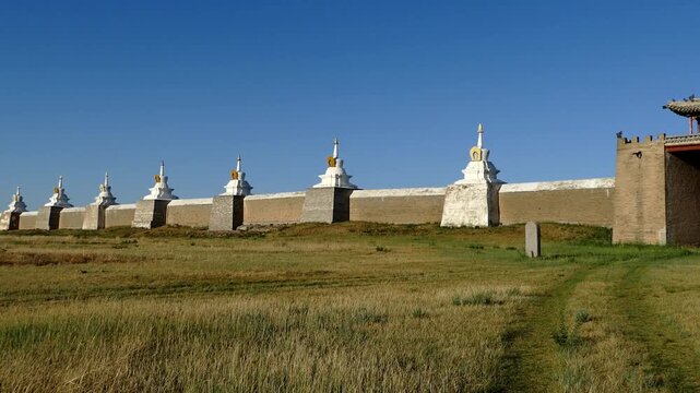 The walls and gates of the ancient Mongolian monastery. Stupas are sacred Buddhist structures, masonry. Monastery  Erdene Zuu, Mongolia. Sunny summer day.