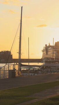 Cinematic sailing perspective approaching the coastal city of Funchal at sunset