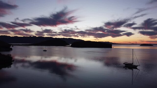 Early morning ocean and sailboat