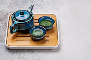 Asian tea ceremony set with teapot and cups
