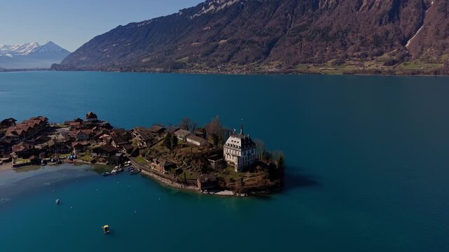 Aerial View of Iseltwald Pier, Famous Location in Switzerland. Drone Shot of Lake Brienz and the Famous Crash Landing on You Pier.
