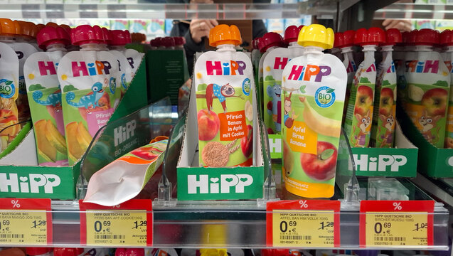 FRANKFURT AM MAIN, Germany - November 1, 2025.HiPP organic fruit pouches and cookies on display in a supermarket in Germany