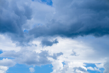 Obraz premium Dramatic Cumulus Clouds in Blue Sky After Summer Rain