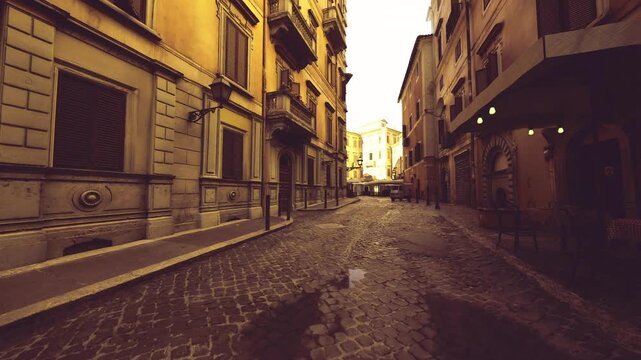 close architectural study of cobblestone texture and ornate facades, warm sunset tones creating long shadows, empty lane emphasizing material detail