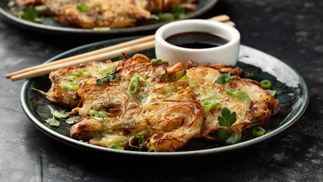 Korean cabbage pancake with vegetables and soy sauce. Asian food style