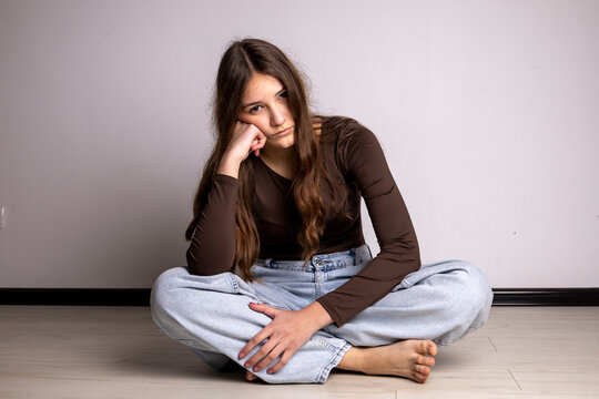 Young woman feeling bored and lonely at home