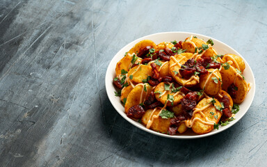 Fototapeta premium Patatas bravas with chorizo and sauce. Spanish traditional food