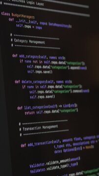 Vibe coding session with ai assistant visible on screen displaying source code. Programming workflow reflects automation, digital innovation and modern software development process.