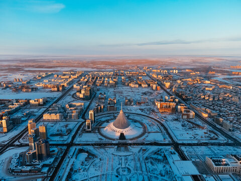 Aerial drone view Nur-Sultan, Kazakhstan Qazaqstan city center with skyscrapers and Baiterek Tower.