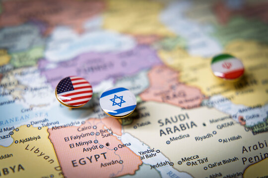 Political map of the Middle East with flag pins of USA, Israel, and Iran on key geographic locations, representing international relations and geopolitical alliance concept
