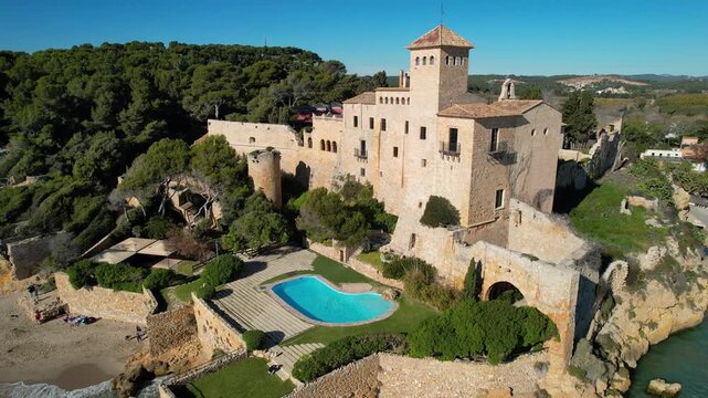 Tamarit, Tarragona, Spain - 218th January, 2026: Travel in the country. Backward reveal aerial shot of Tamarit castle on sunny day.