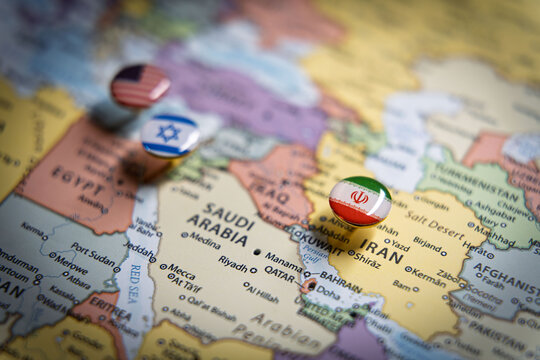 Political map of the Middle East with flag pins of USA, Israel, and Iran on key geographic locations, representing international relations and geopolitical alliance concept
