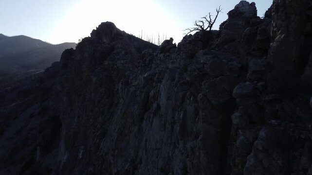 Sun over rocky ridge 