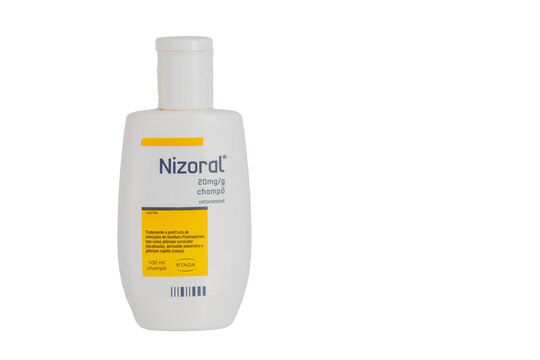 Nizoral shampoo bottle for dandruff treatment with transparent background