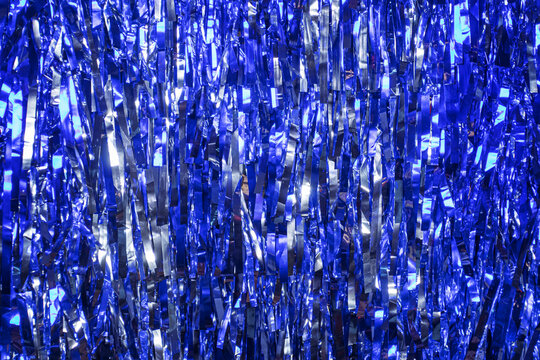 Abstract glowing background with blue glitter texture