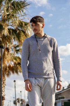 Young man in casual wear standing outdoors