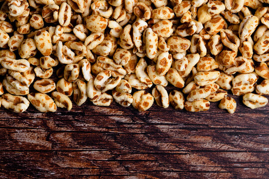 Puffed spelt cereal on rustic wooden table
