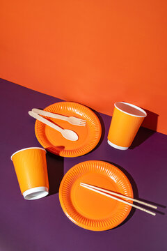 Vibrant disposable tableware with orange theme