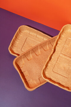 Biodegradable disposable dishes with colorful backdrop