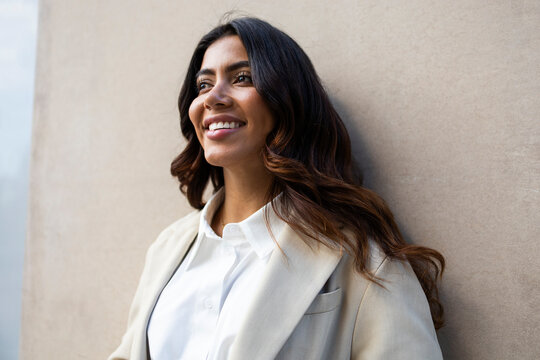Confident hispanic businesswoman in professional attire