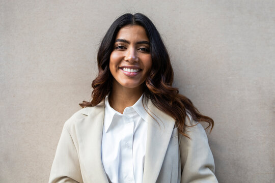 Confident hispanic businesswoman in professional attire