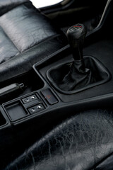 Obraz premium Car interior with manual gear shift and control buttons on console