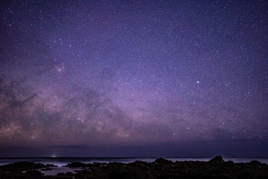 Lava flows, Honolulu Volcanics. Milky Way rises from the sea in the early morning of February 26. Oahu, Hawaii. Coastal erosion. Constellation directions: Centaurus, Southern Cross, Lupus, Scorpius 