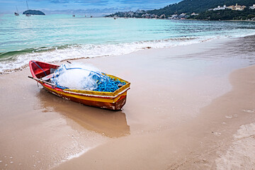 Fishing boats with their nets on the sands of Jurerê beach. Florianópolis, SC, Brazil, 2019