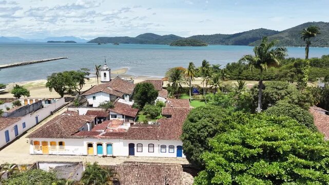 Aerial view of Paraty colonial town with tropical ocean and mountains Brazil