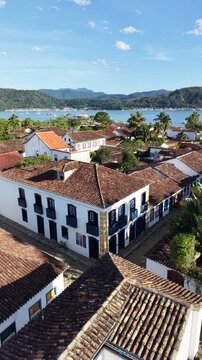 Aerial view of Paraty colonial town with tropical ocean and mountains Brazil