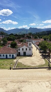 Aerial view of Paraty colonial town with tropical ocean and mountains Brazil