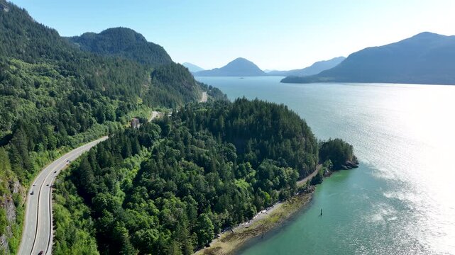 Drone Flying Forward Along Sea to Sky Highway Above Howe Sound, British Columbia Canada